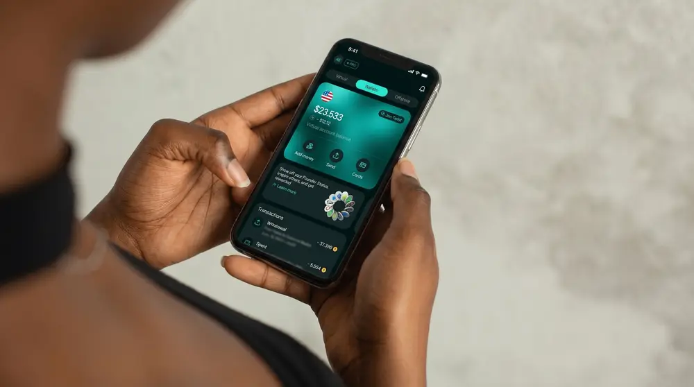 Hand holding phone showing Nummus offshore account